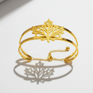 Front view of autumn leaf bracelet displaying symmetrical leaf pattern and polished gold finish