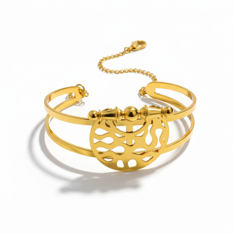 Heritage Dome Bracelet - 24K gold plated stainless steel bangle with circular geometric cutout pattern and ornate barrel clasp, three-quarter view on white background