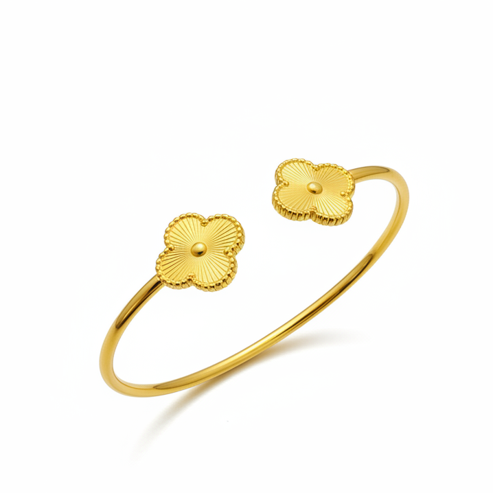 Golden Clover Bangle angled view displaying luxury gold finish and decorative clover ends
