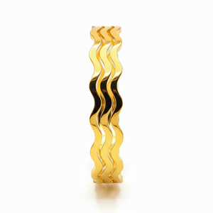 OSHAS Golden Wave Bangle close-up showing luxurious wavy texture and brilliant gold finish